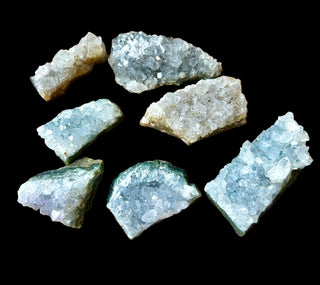 Set of crystal rock samples on a black background