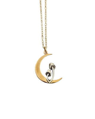 A gold crescent moon pendant necklace featuring a stylized mushroom design, suspended from a delicate gold chain against a plain white background.